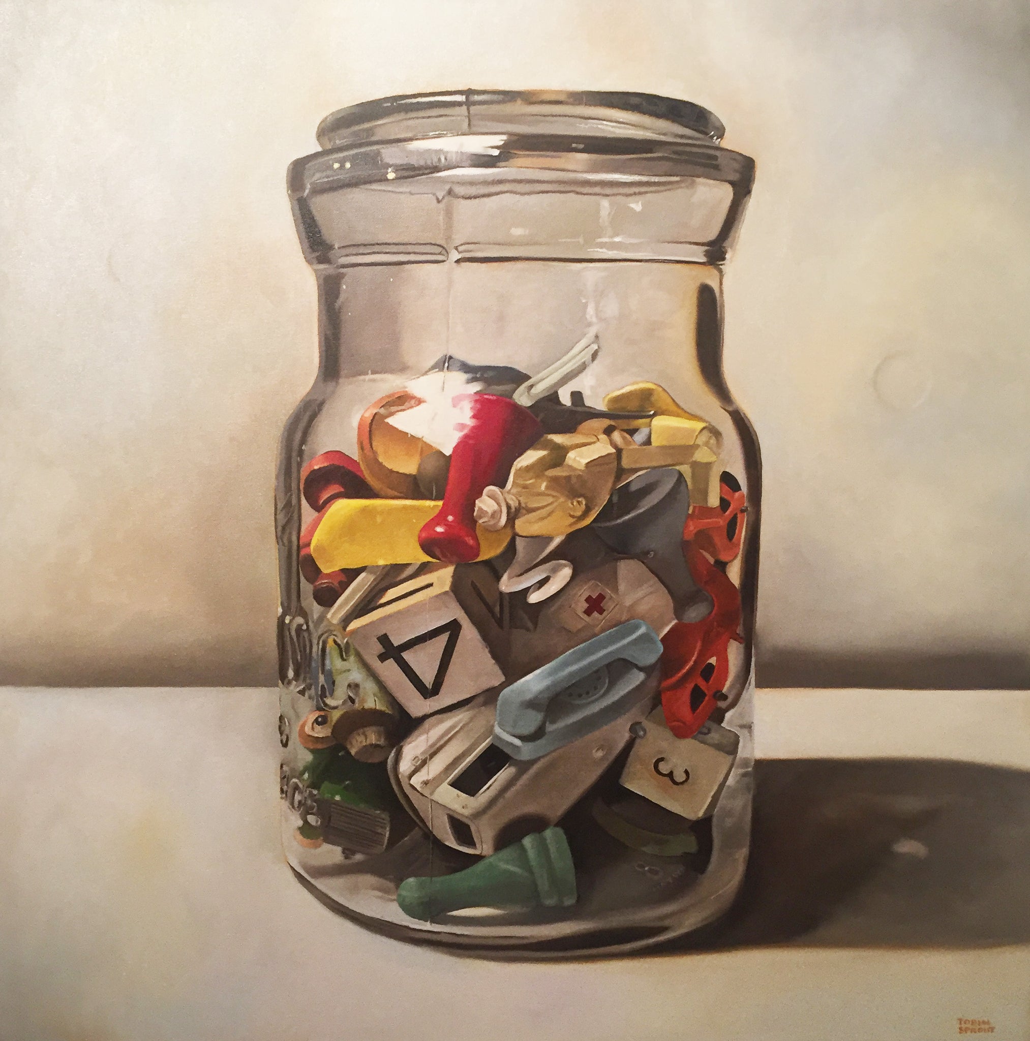 Oil painting of a clear glass jar filled with game pieces. Oil on canvas by Tobin Sprout